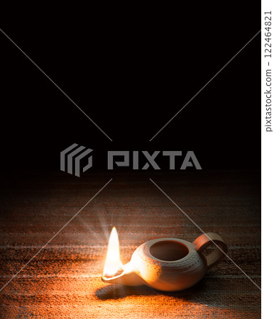 Ancient lamp shines in the dark Ancient lamp shines in the dark 122464821