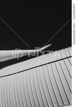 Minimalism, abstraction. A spotlight on the background of the stadium wall. Minimalism, abstraction. A spotlight on the background of the stadium wall. 122464847