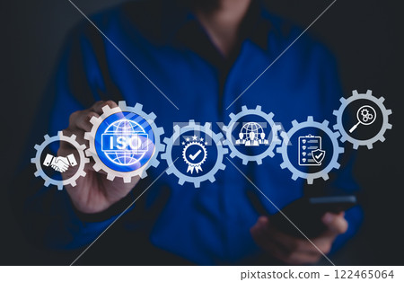 ISO Certification Concept. Businessman touch representation of ISO certification, icons symbolizing quality assurance, compliance, global standards, and International organization for standardization. ISO Certification Concept. Businessman touch representation of ISO certification, icons symbolizing quality assurance, compliance, global standards, and International organization for standardization. 122465064