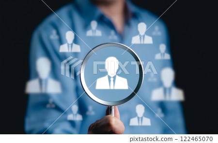 HR, Human resources and recruitment concept. Magnifying glass focused on icon of professional, a symbol human resources, recruitment, and headhunting. identifying, selecting talent for business roles, HR, Human resources and recruitment concept. Magnifying glass focused on icon of professional, a symbol human resources, recruitment, and headhunting. identifying, selecting talent for business roles, 122465070