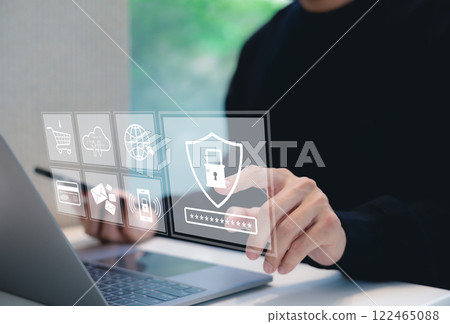 Cybersecurity and Data Protection Technology Concept. Man interacts with security icons, lock symbol, password protection, and global connectivity, represent data privacy and cyber security measures. Cybersecurity and Data Protection Technology Concept. Man interacts with security icons, lock symbol, password protection, and global connectivity, represent data privacy and cyber security measures. 122465088