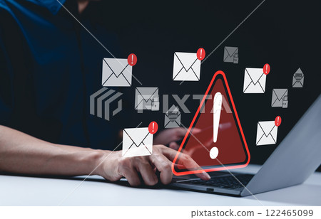 Email security warning notification concept. A person using laptop with email security alert icons and warning notifications, indicating cybersecurity threats such as spam, viruses, junk mail, scams, Email security warning notification concept. A person using laptop with email security alert icons and warning notifications, indicating cybersecurity threats such as spam, viruses, junk mail, scams, 122465099