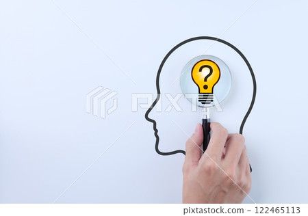 Idea discovery and inquiry concept. Hand holding a magnifying glass over question marks with light bulb, symbolizing idea discovery. Problem solving, Creative thinking, Company find business solution, Idea discovery and inquiry concept. Hand holding a magnifying glass over question marks with light bulb, symbolizing idea discovery. Problem solving, Creative thinking, Company find business solution, 122465113