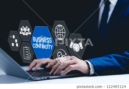 Business continuity and strategy concept. Businessman use laptop with digital icons represent business continuity, global operations, teamwork, workflow, and strategic planning in diverse conditions. 122465124