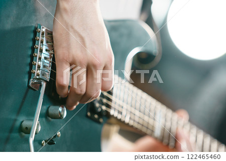 Close up of man playing on electric guitar 122465460