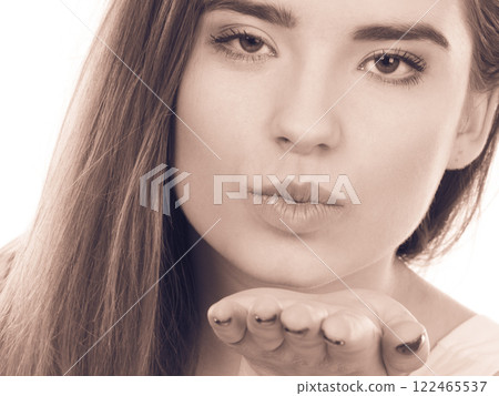 Teenager woman sending air kisses, love gesture Teenager woman sending air kisses, love gesture 122465537