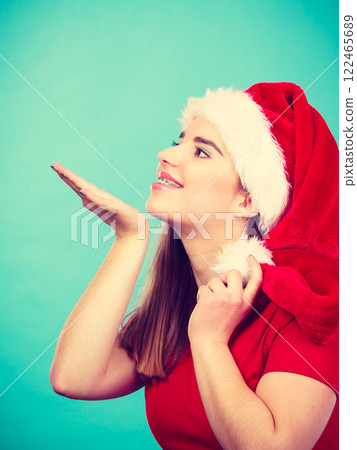 Happy woman wearing Santa Claus helper costume Happy woman wearing Santa Claus helper costume 122465689