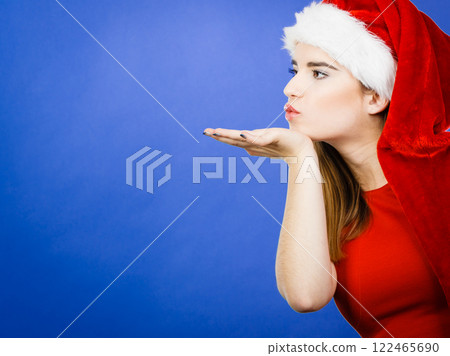 Woman christmas costume sending kisses Woman christmas costume sending kisses 122465690