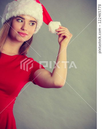 Positive woman wearing Santa Claus helper costume 122465778
