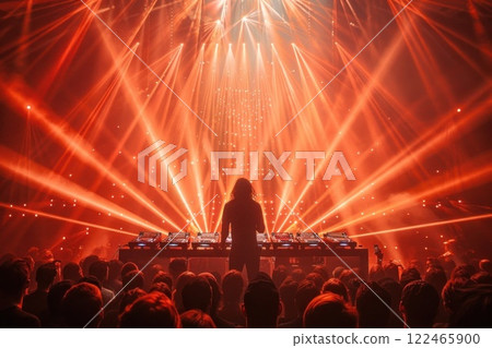 Female DJ at the Turntable Playing Music in Night Club with Red Laser Light Show 122465900