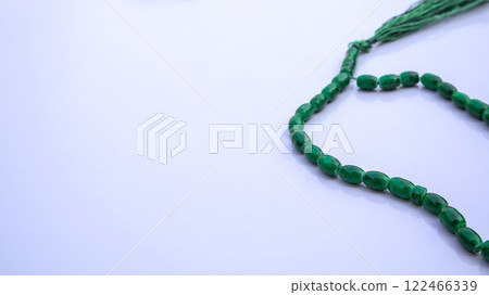 Islamic Prayer Beads, Green Tasbeeh, Misbaha, Rosary on White Background with Copy Space Islamic Prayer Beads, Green Tasbeeh, Misbaha, Rosary on White Background with Copy Space 122466339