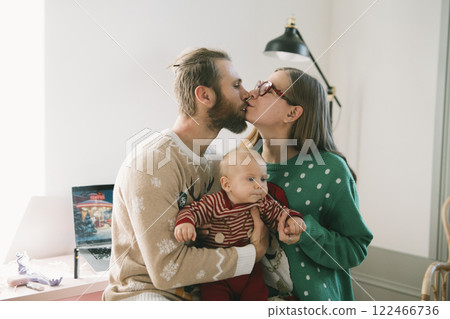 Experience the warmth and joy of family love through cozy holiday moments with your baby Experience the warmth and joy of family love through cozy holiday moments with your baby 122466736