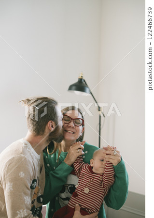 Family Moments Experiencing the Holiday Cheer and Sharing Joyful Smiles Together 122466739