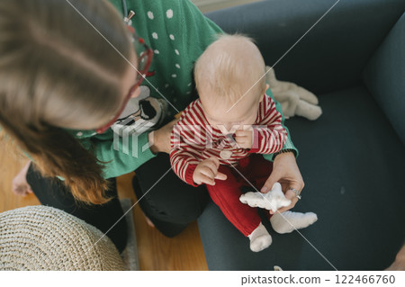 Delightful Cozy Moments The Wonderful Holiday Joy Shared Between Parent and Child 122466760