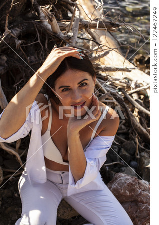 young pretty brunette woman on sea coast, lifestyle people concept 122467249