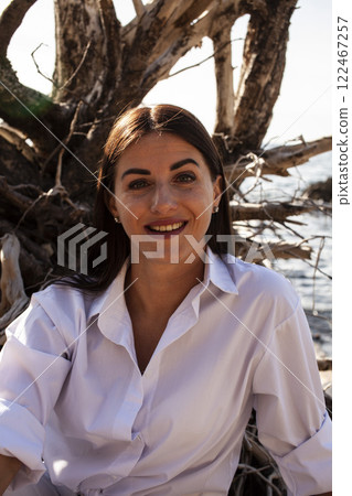 young pretty brunette woman on sea coast, lifestyle people concept 122467257