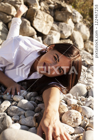 young pretty brunette woman on sea coast, lifestyle people concept 122467258