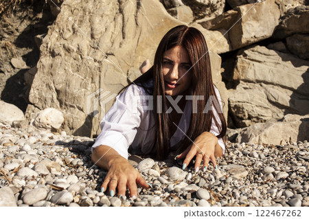 young pretty brunette woman on sea coast, lifestyle people concept 122467262
