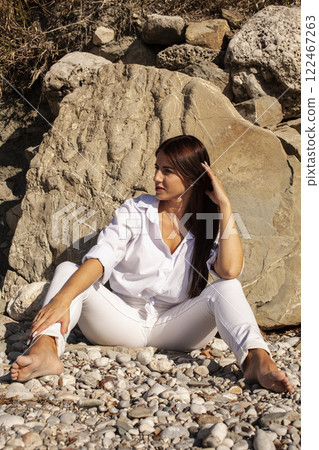 young pretty brunette woman on sea coast, lifestyle people concept 122467263