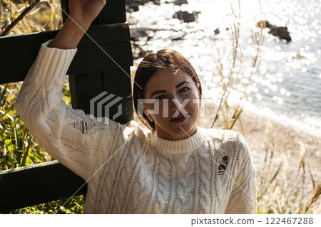 young pretty brunette woman on sea coast, lifestyle people concept young pretty brunette woman on sea coast, lifestyle people concept 122467288