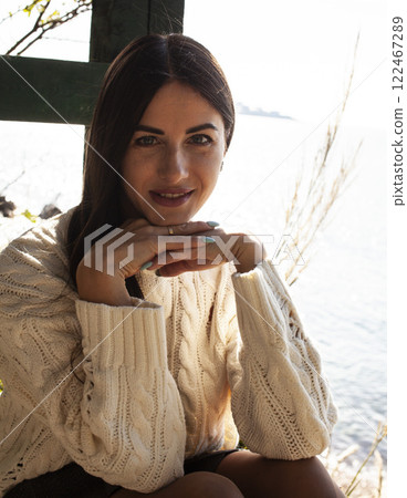 young pretty brunette woman on sea coast, lifestyle people concept young pretty brunette woman on sea coast, lifestyle people concept 122467289
