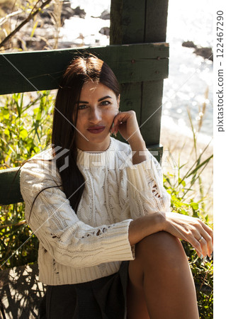 young pretty brunette woman on sea coast, lifestyle people concept young pretty brunette woman on sea coast, lifestyle people concept 122467290
