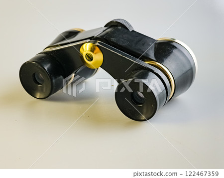 Vintage Soviet theater binoculars on a white background. An accessory for theater lovers. Old Soviet theater binoculars Vintage Soviet theater binoculars on a white background. An accessory for theater lovers. Old Soviet theater binoculars 122467359