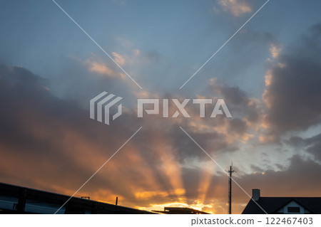 Sunset clouds Rembrandt rays 122467403