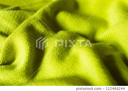 Horizontal brigh yellow coloured knitted texture as a backdrop. Horizontal brigh yellow coloured knitted texture as a backdrop. 122468244