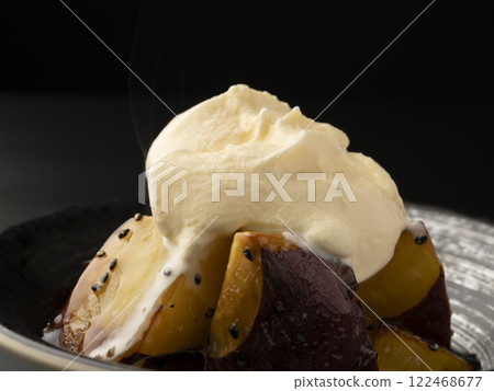 Hot candied sweet potato topped with ice cream - Sweet potato affogato 122468677