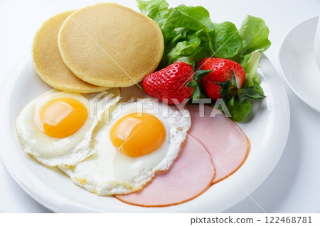 Breakfast ham eggs and pancakes 122468781
