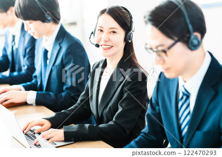 An operator at a support center assisting customers 122470293