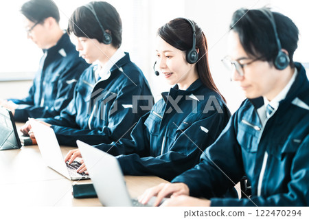 A female engineer in work clothes providing customer support 122470294