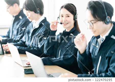 A female engineer in work clothes providing customer support 122470295