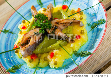 Trout steaks served with potato puree 122470931