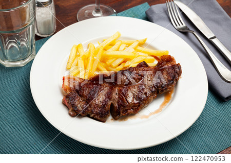Grilled veal entrecote with crispy French fries 122470953