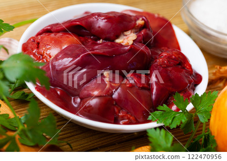Chicken liver ready for cooking on cutting board 122470956