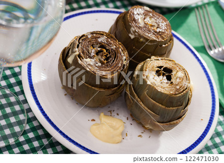 Plate of tasty steamed artichoke Plate of tasty steamed artichoke 122471030