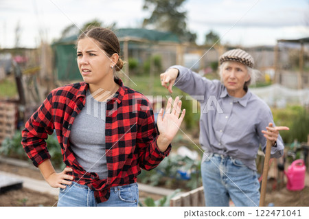 Conflict between female neighbors in country farm Conflict between female neighbors in country farm 122471041