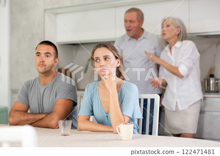 Old couple quarrel with young couple 122471481