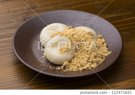 Kinako mochi served on a plate on a wooden table 122471681