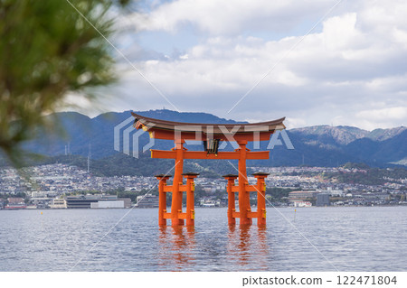 [Miyajima, Hiroshima: Large Torii Gate and Pine Trees] 122471804