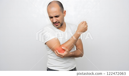 Middle-Aged Caucasian Man Experiencing Elbow Pain and Discomfort 122472063