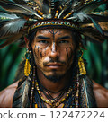 Brutal Peruvian shaman in the jungle with feathers on his head and earrings in his ears 122472224