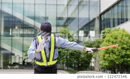 Traffic controller directing traffic 122472346