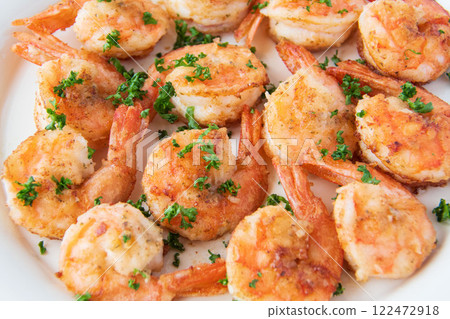 Garlic shrimp on a white plate Garlic shrimp on a white plate 122472918