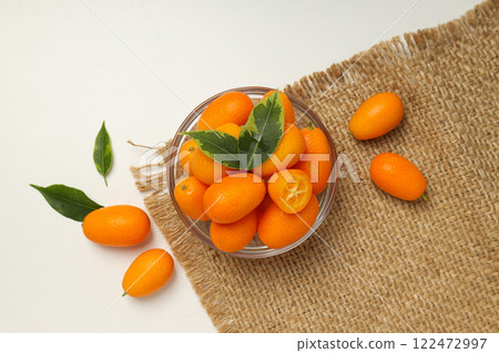 Kumquat in bowl on white background, top view 122472997