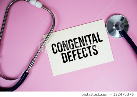 Congeital Defects text with stethoscope on pink background, Healthy and wellness concept 122473376