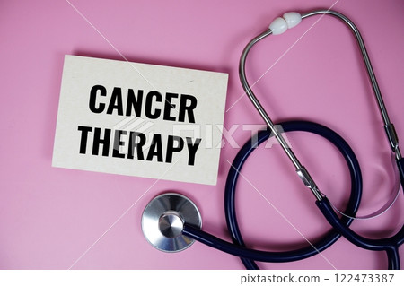 Cancer Therapy text with stethoscope top view on pink background, Healthy and wellness concept 122473387