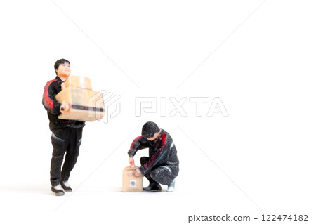Miniature figurine of a delivery worker carrying  packages Concept of service and reliability in a creative 122474182